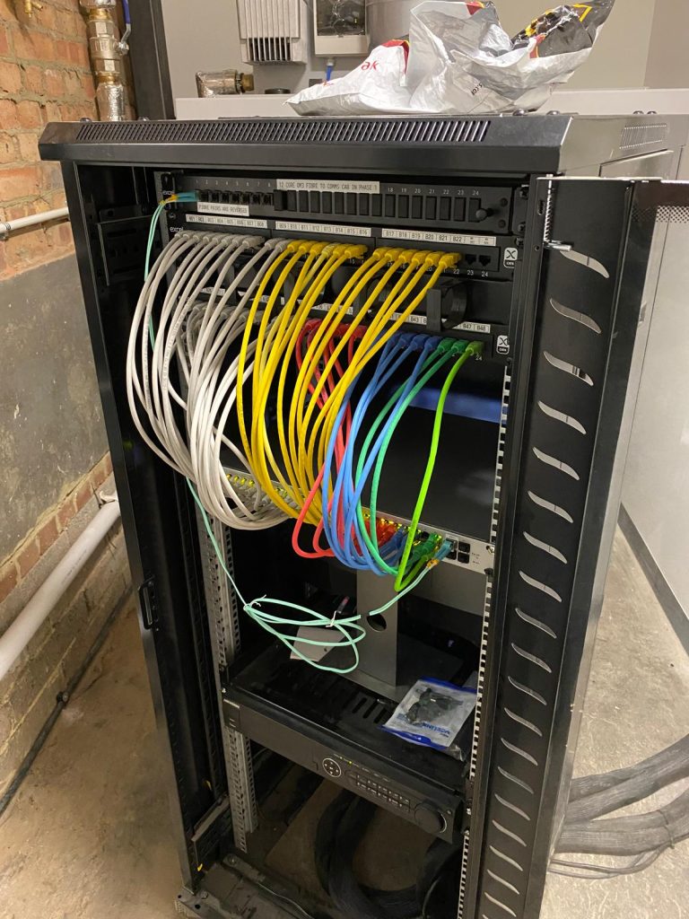 Data cabinet with Ubiquity equipment fitted in Acton
